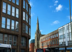 Surrey town street showing residential and commercial properties covered by our local asbestos service area.